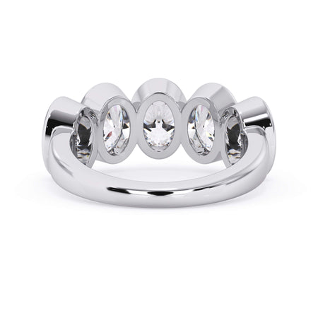 A picture of a five stone diamond wedding ring with oval shape diamonds that are bezel set in white gold or platinum on a white background with a view of the underside of the ring.