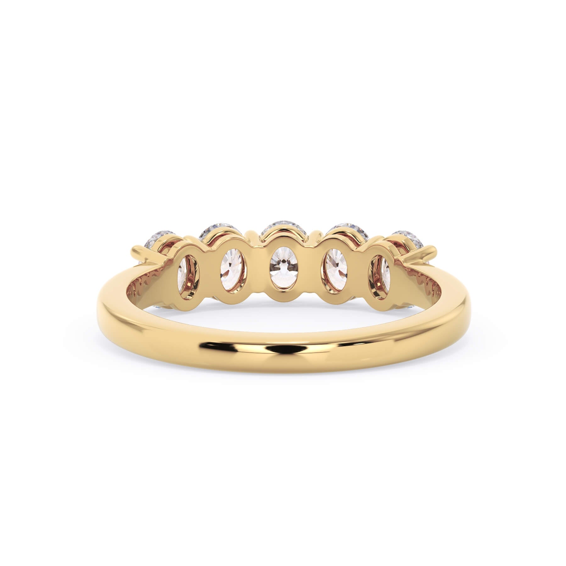 A picture of a five stone diamond wedding ring with oval shape diamonds that are shared prong set in yellow gold on a white background with a view of the underside of the ring.