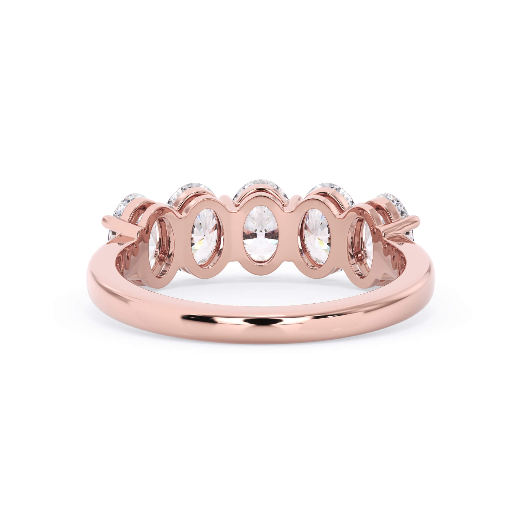 A picture of a five stone diamond wedding ring with oval shape diamonds that are shared prong set in rose gold on a white background with a view of the underside of the ring.