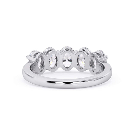 A picture of a five stone diamond wedding ring with oval shape diamonds that are shared prong set in white gold or platinum on a white background with a view of the underside of the ring.