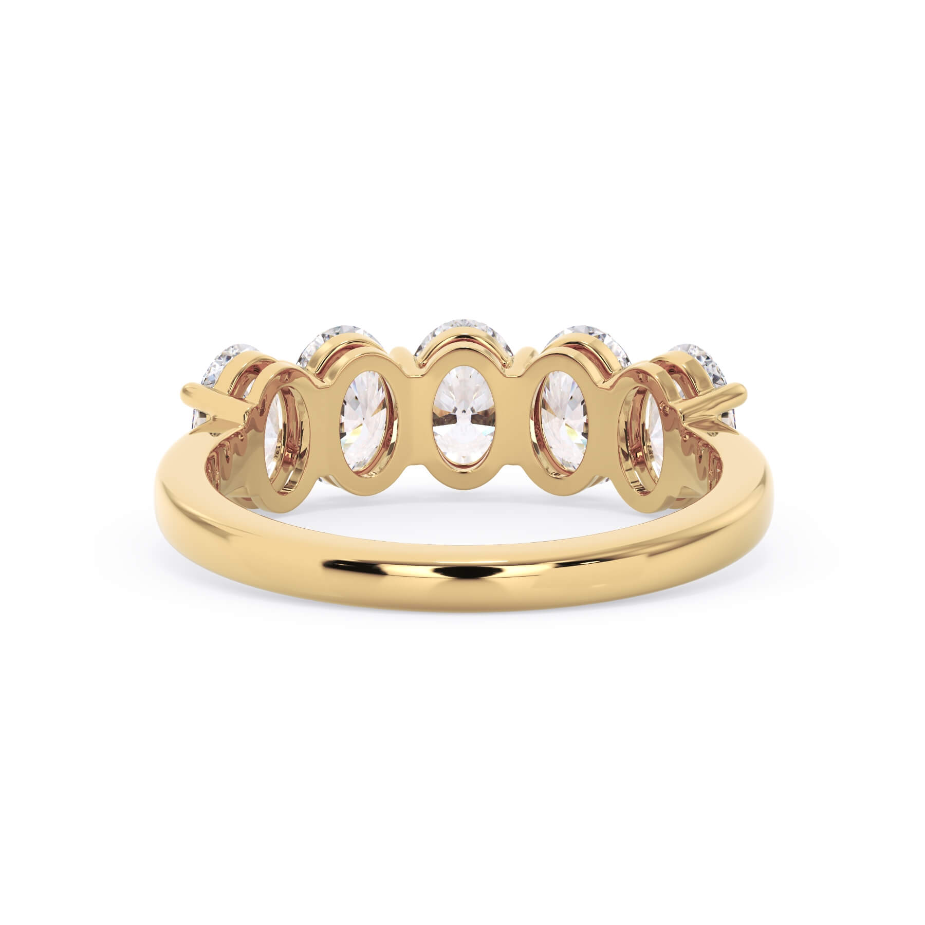 A picture of a five stone diamond wedding ring with oval shape diamonds that are shared prong set in yellow gold on a white background with a view of the underside of the ring.