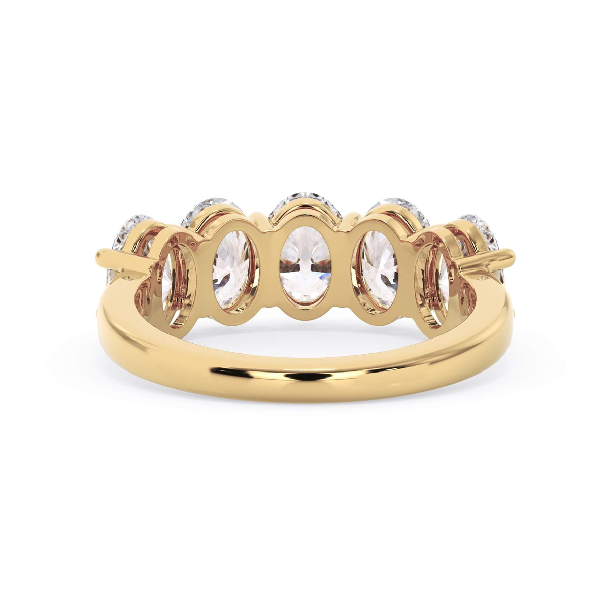 A picture of a five stone diamond wedding ring with oval shape diamonds that are shared prong set in yellow gold on a white background with a view of the underside of the ring.