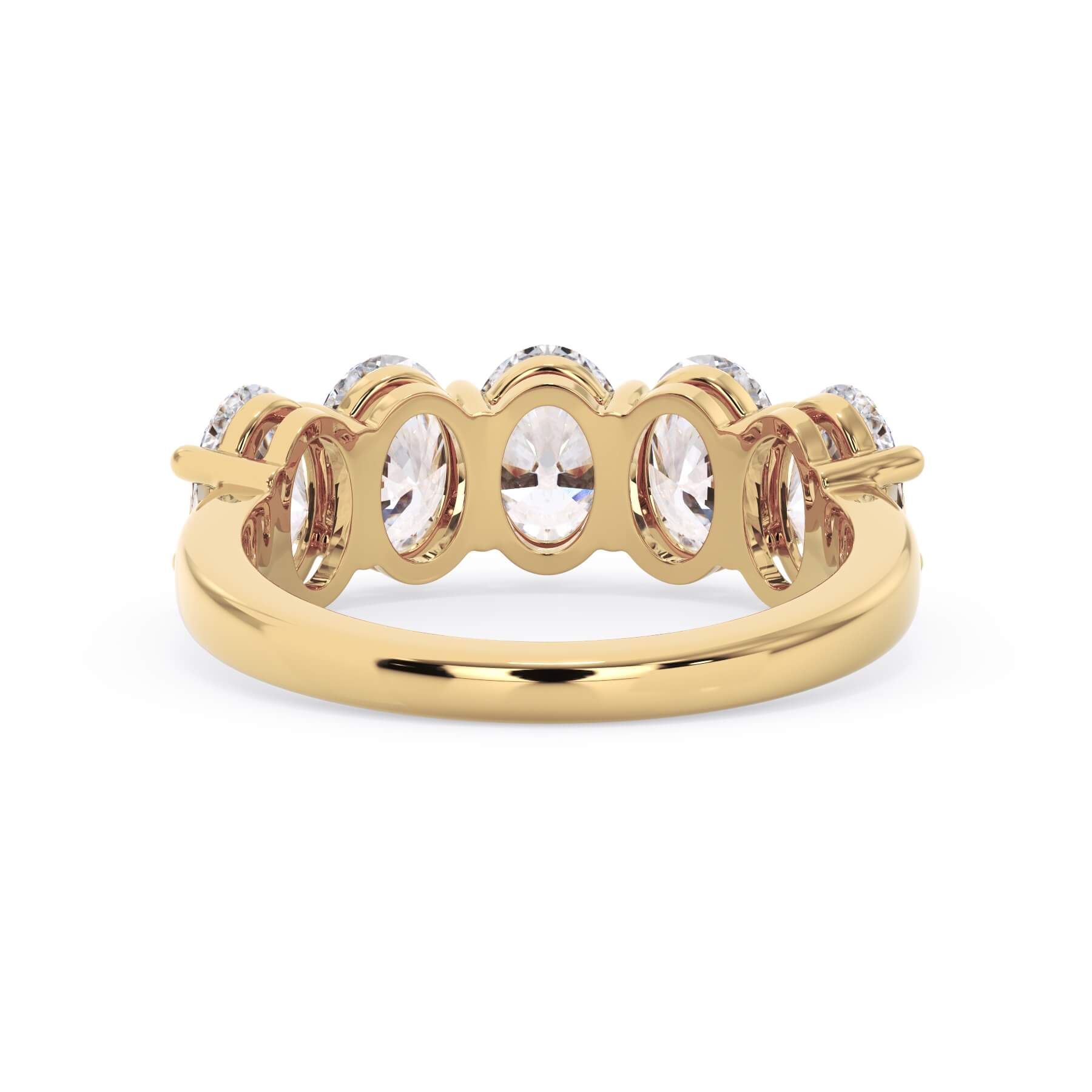 A picture of a five stone diamond wedding ring with oval shape diamonds that are shared prong set in yellow gold on a white background with a view of the underside of the ring.