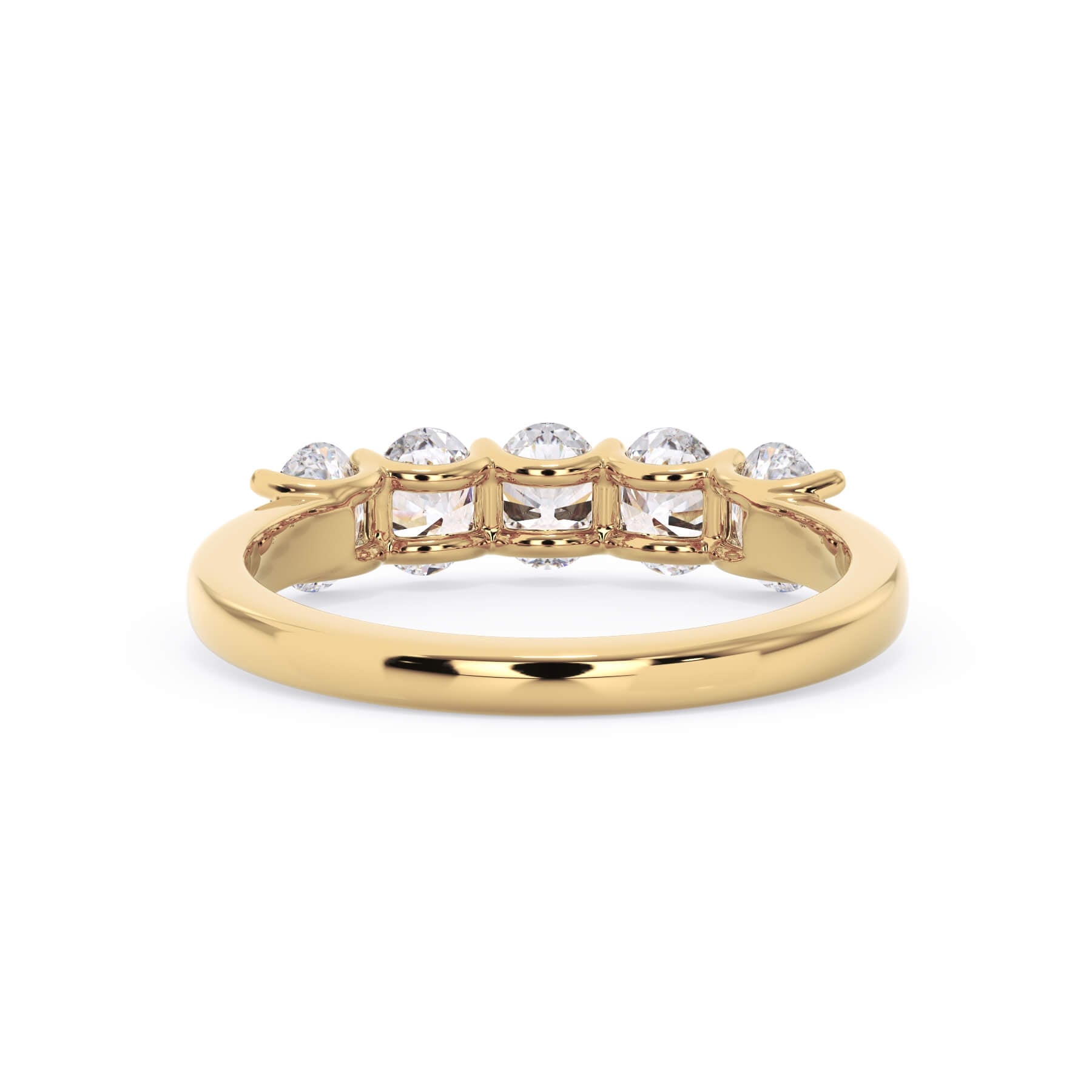 A picture of a five stone diamond wedding ring with oval shape diamonds that are u prong set in yellow gold on a white background with a view of the underside of the ring.