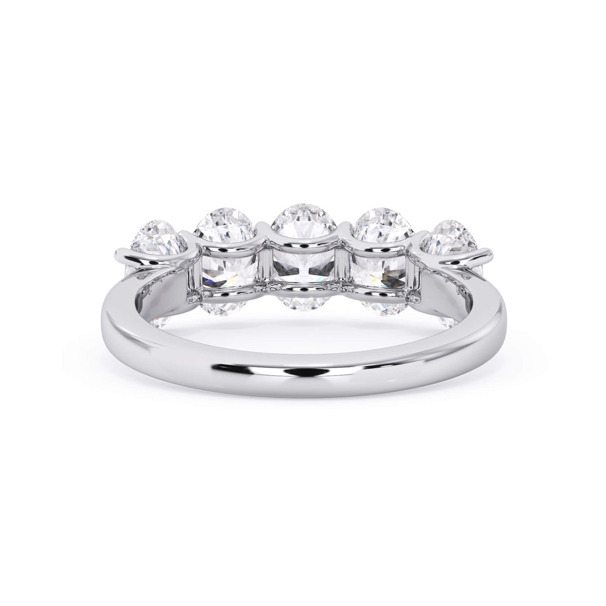 A picture of a five stone diamond wedding ring with oval shape diamonds that are u prong set in white gold or platinum on a white background with a view of the underside of the ring.