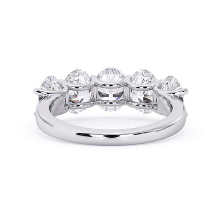 A picture of a five stone diamond wedding ring with oval shape diamonds that are u prong set in white gold or platinum on a white background with a view of the underside of the ring.
