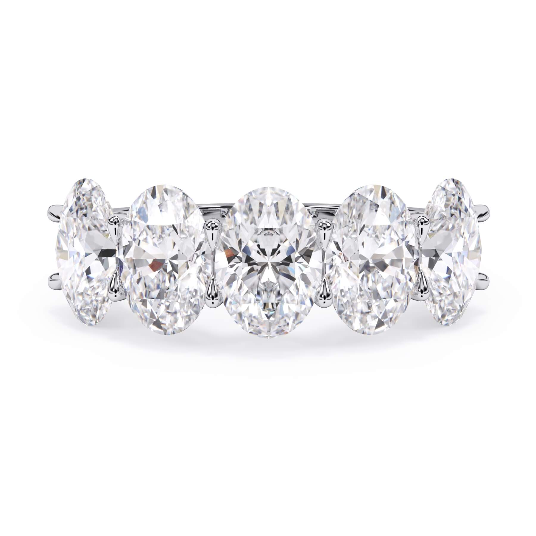 A picture of a five stone diamond wedding ring with oval shape diamonds that are u prong set in white gold or platinum on a white background with the ring facing forward, lying down.