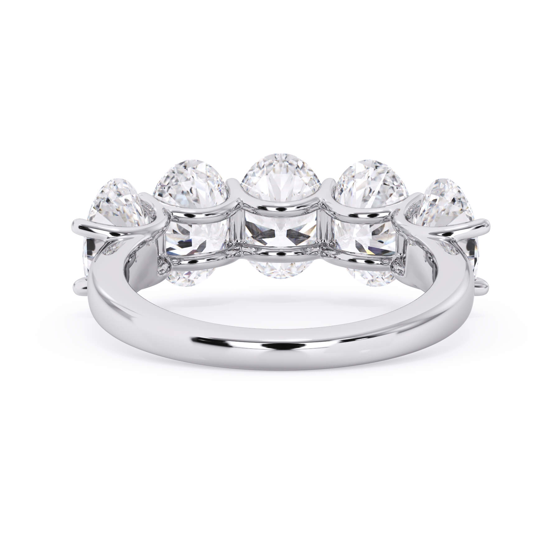 A picture of a five stone diamond wedding ring with oval shape diamonds that are u prong set in white gold or platinum on a white background with a view of the underside of the ring.