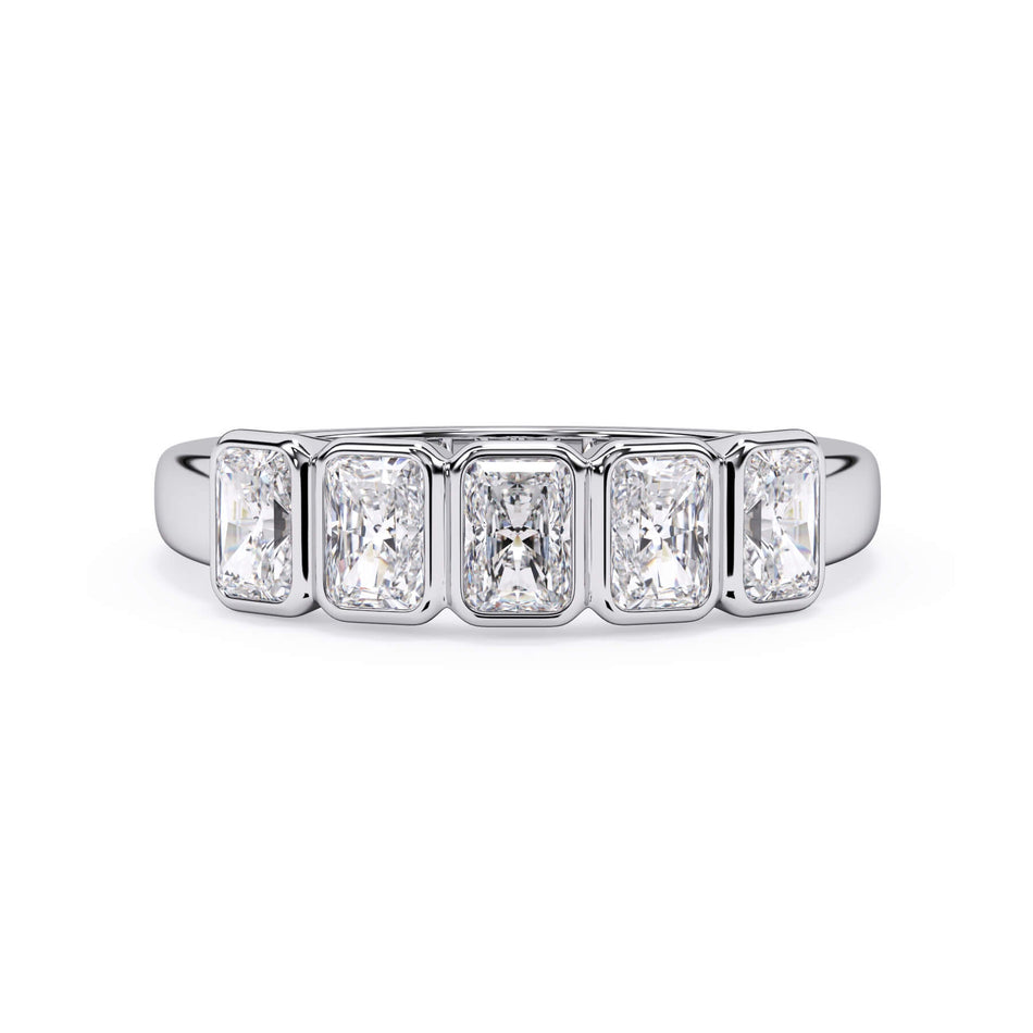 A picture of a five stone diamond wedding ring with radiant cut diamonds that are bezel set in white gold or platinum on a white background with the ring facing forward, lying down.