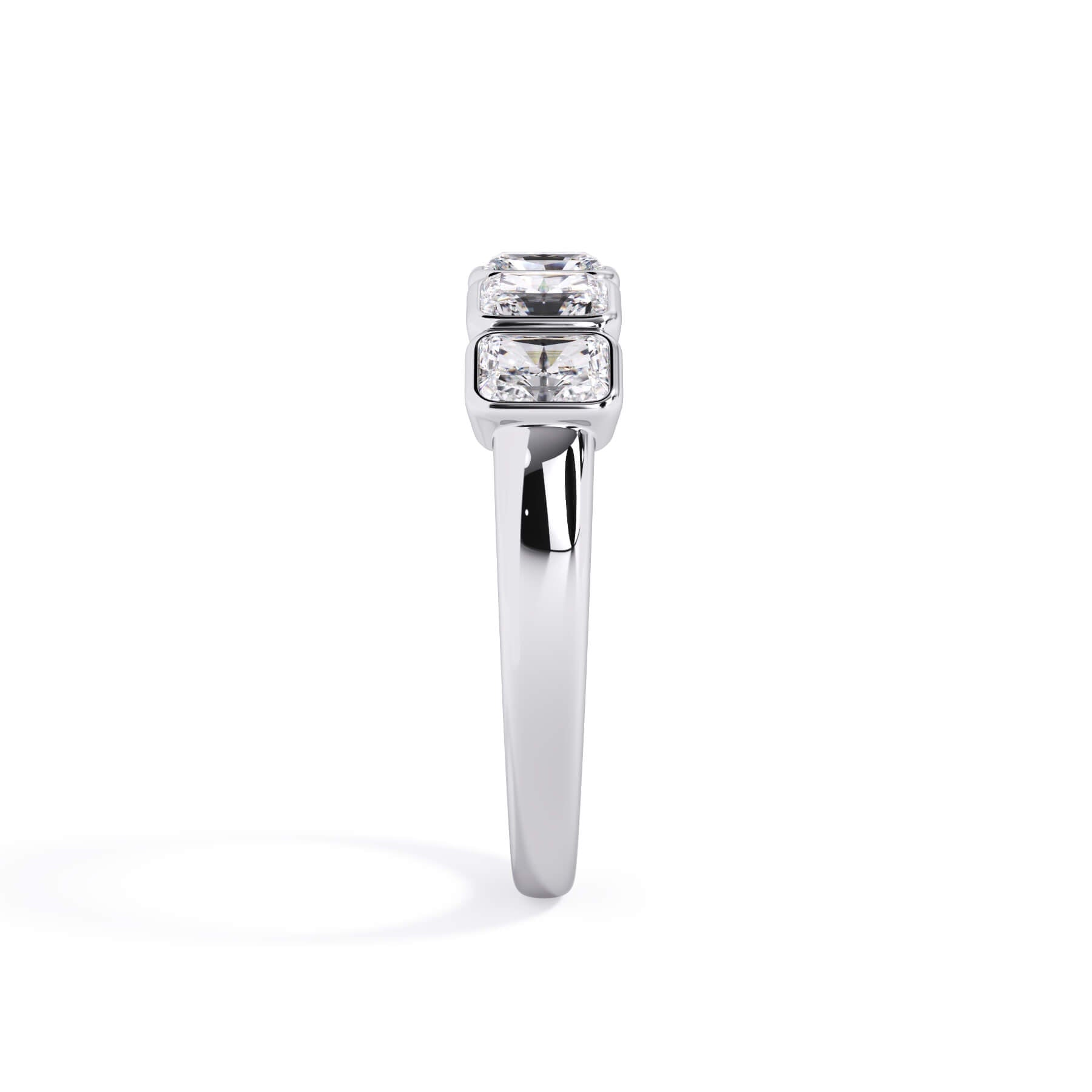 A picture of a five stone diamond wedding ring with radiant cut diamonds that are bezel set in white gold or platinum on a white background with a side profile view.