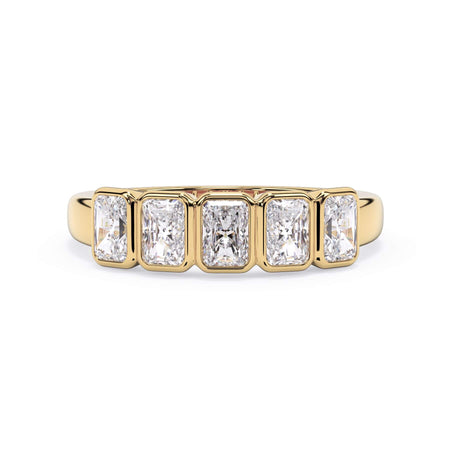 A picture of a five stone diamond wedding ring with radiant cut diamonds that are bezel set in yellow gold on a white background with the ring facing forward, lying down.