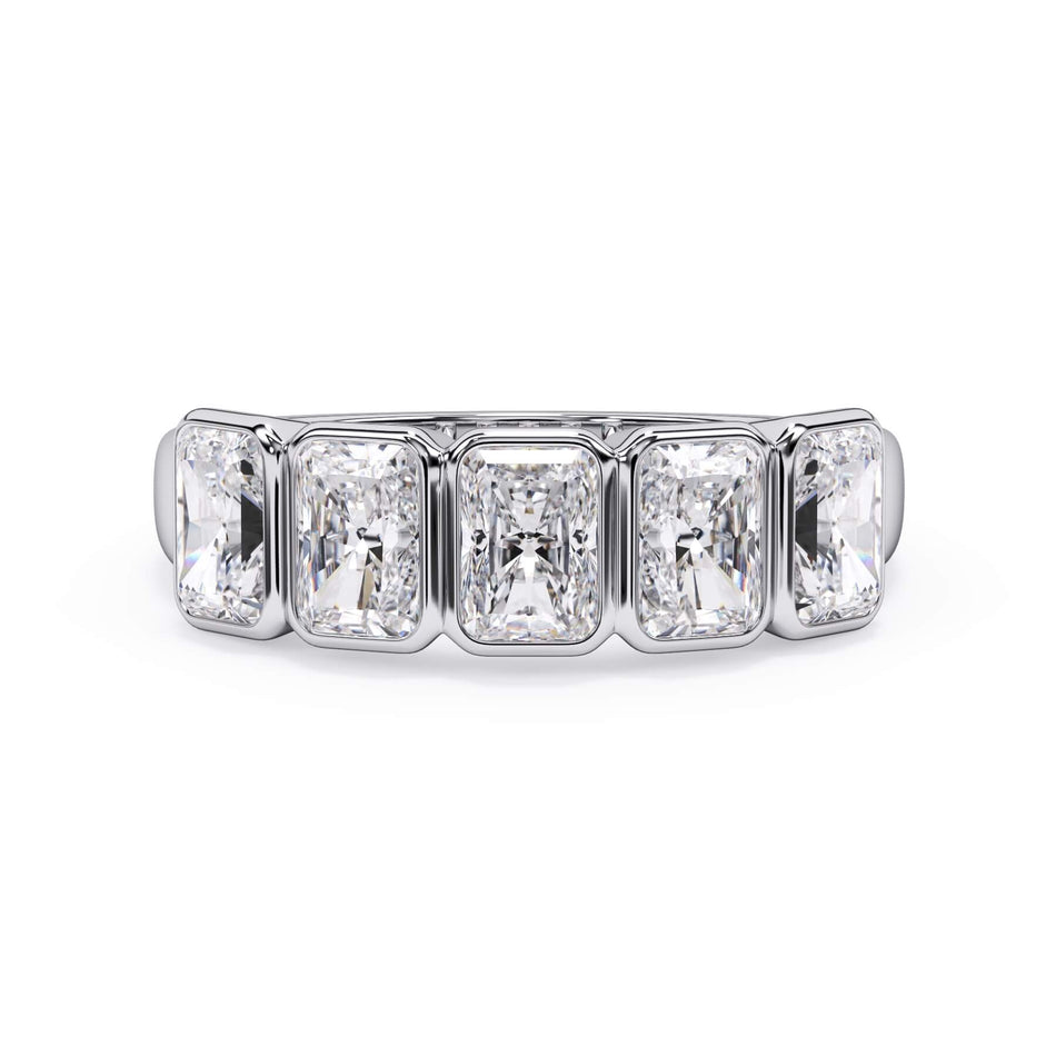 A picture of a five stone diamond wedding ring with radiant cut diamonds that are bezel set in white gold or platinum on a white background with the ring facing forward, lying down.