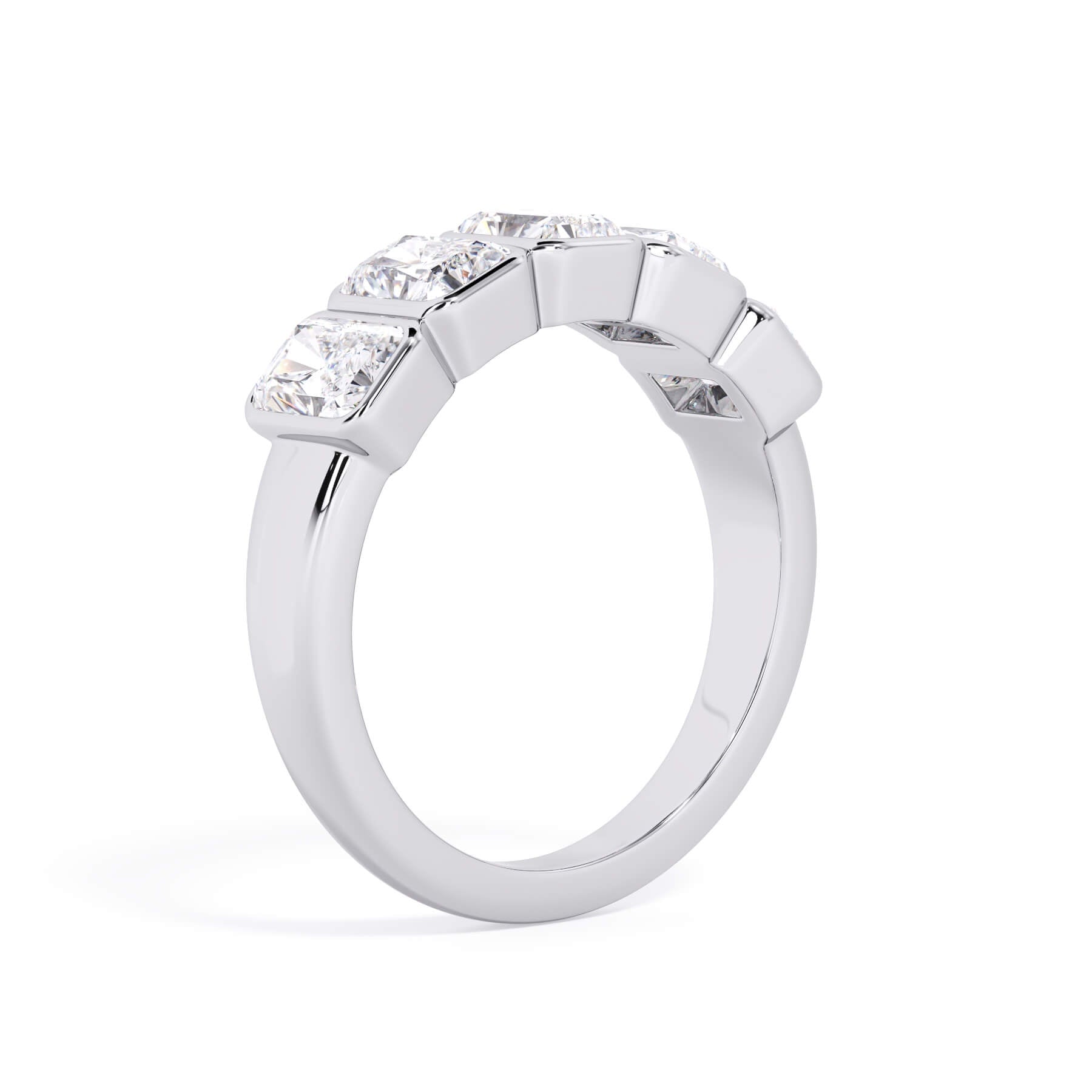 A picture of a five stone diamond wedding ring with radiant cut diamonds that are bezel set in white gold or platinum on a white background with a slightly angled, through the finger view.