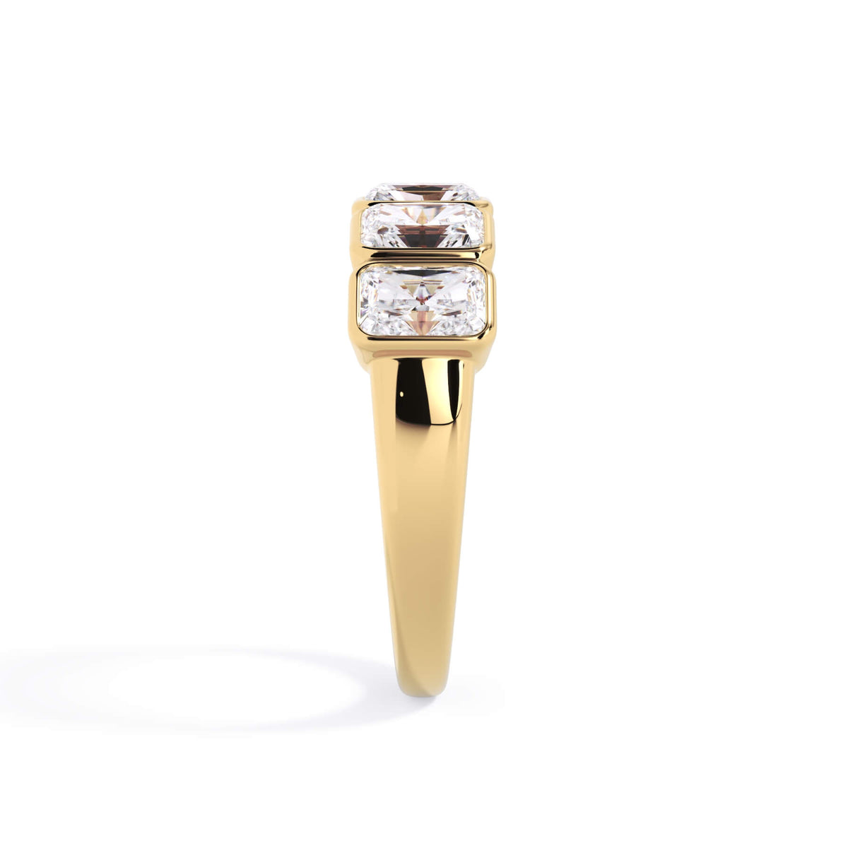 A picture of a five stone diamond wedding ring with radiant cut diamonds that are bezel set in yellow gold on a white background with a side profile view.