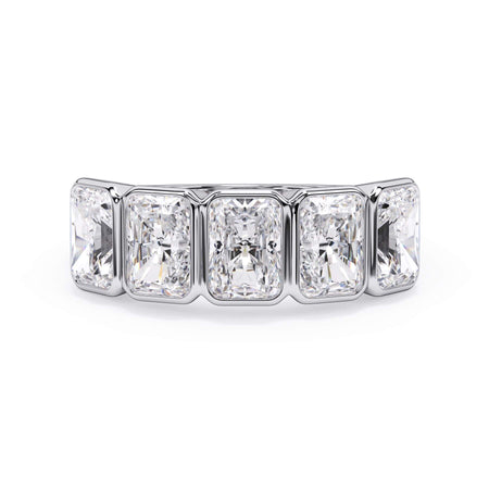 A picture of a five stone diamond wedding ring with radiant cut diamonds that are bezel set in white gold or platinum on a white background with the ring facing forward, lying down.