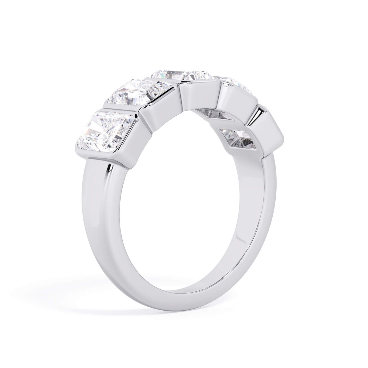 A picture of a five stone diamond wedding ring with radiant cut diamonds that are bezel set in white gold or platinum on a white background with a slightly angled, through the finger view.