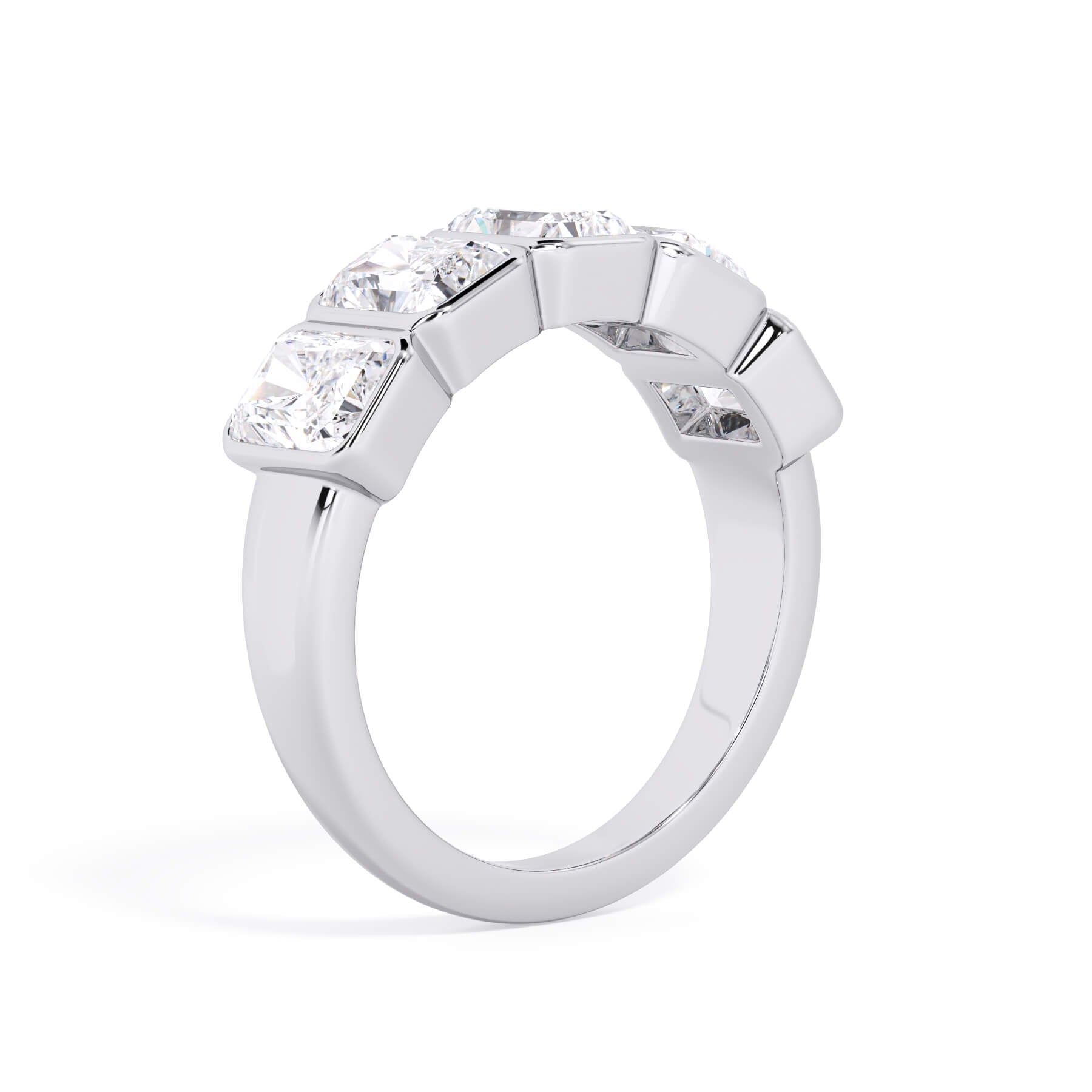 A picture of a five stone diamond wedding ring with radiant cut diamonds that are bezel set in white gold or platinum on a white background with a slightly angled, through the finger view.