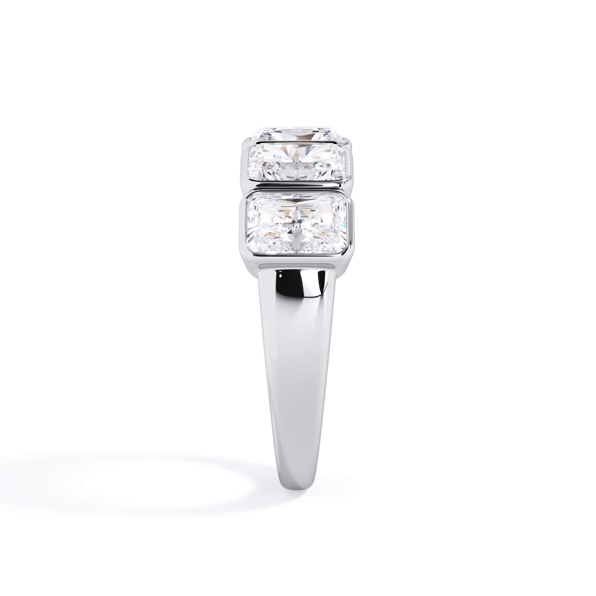 A picture of a five stone diamond wedding ring with radiant cut diamonds that are bezel set in white gold or platinum on a white background with a side profile view.