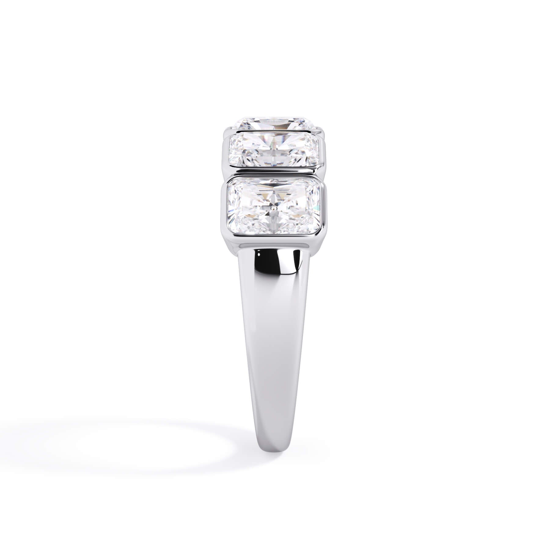 A picture of a five stone diamond wedding ring with radiant cut diamonds that are bezel set in white gold or platinum on a white background with a side profile view.