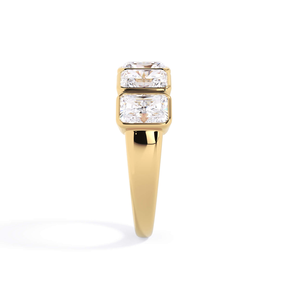 A picture of a five stone diamond wedding ring with radiant cut diamonds that are bezel set in yellow gold on a white background with a side profile view.