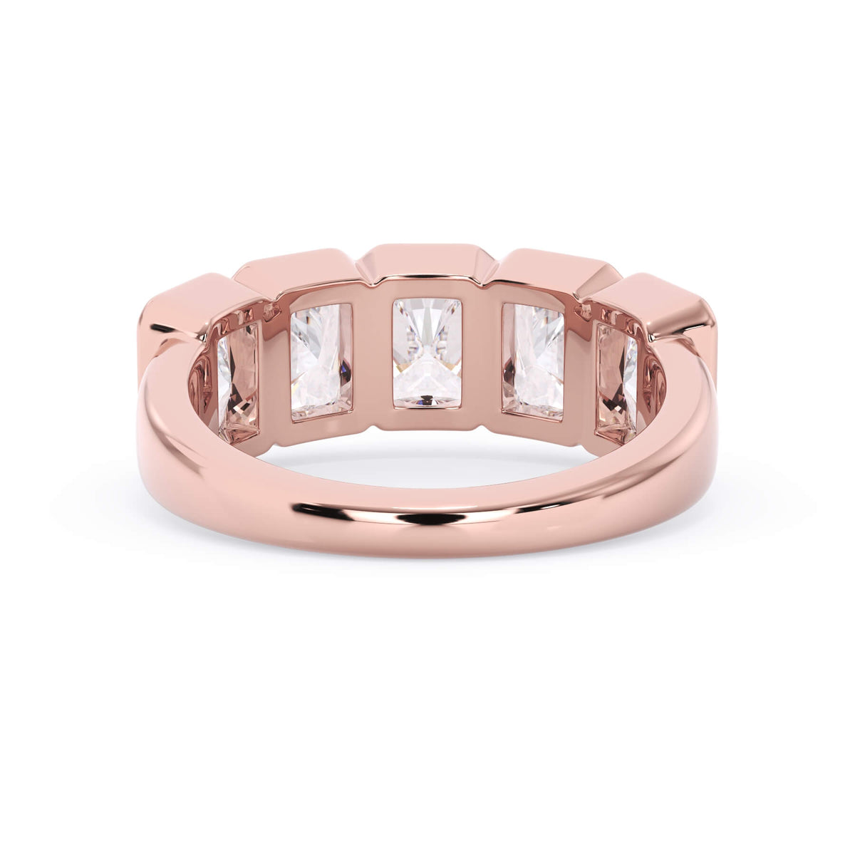 A picture of a five stone diamond wedding ring with radiant cut diamonds that are bezel set in rose gold on a white background with a view of the underside of the ring.