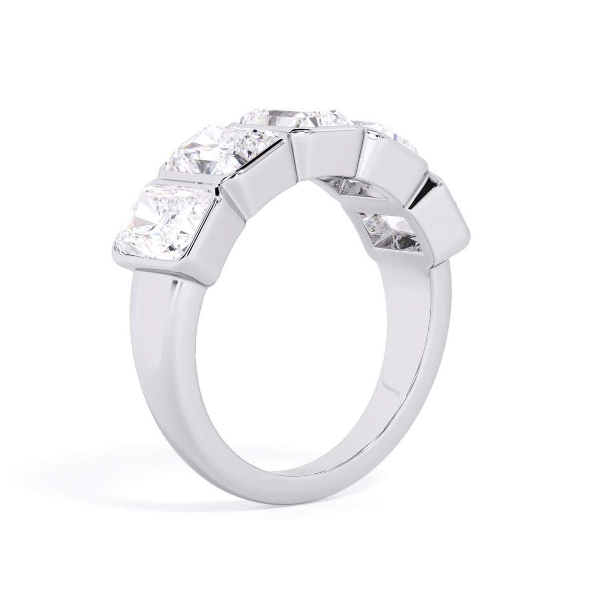 A picture of a five stone diamond wedding ring with radiant cut diamonds that are bezel set in white gold or platinum on a white background with a slightly angled, through the finger view.