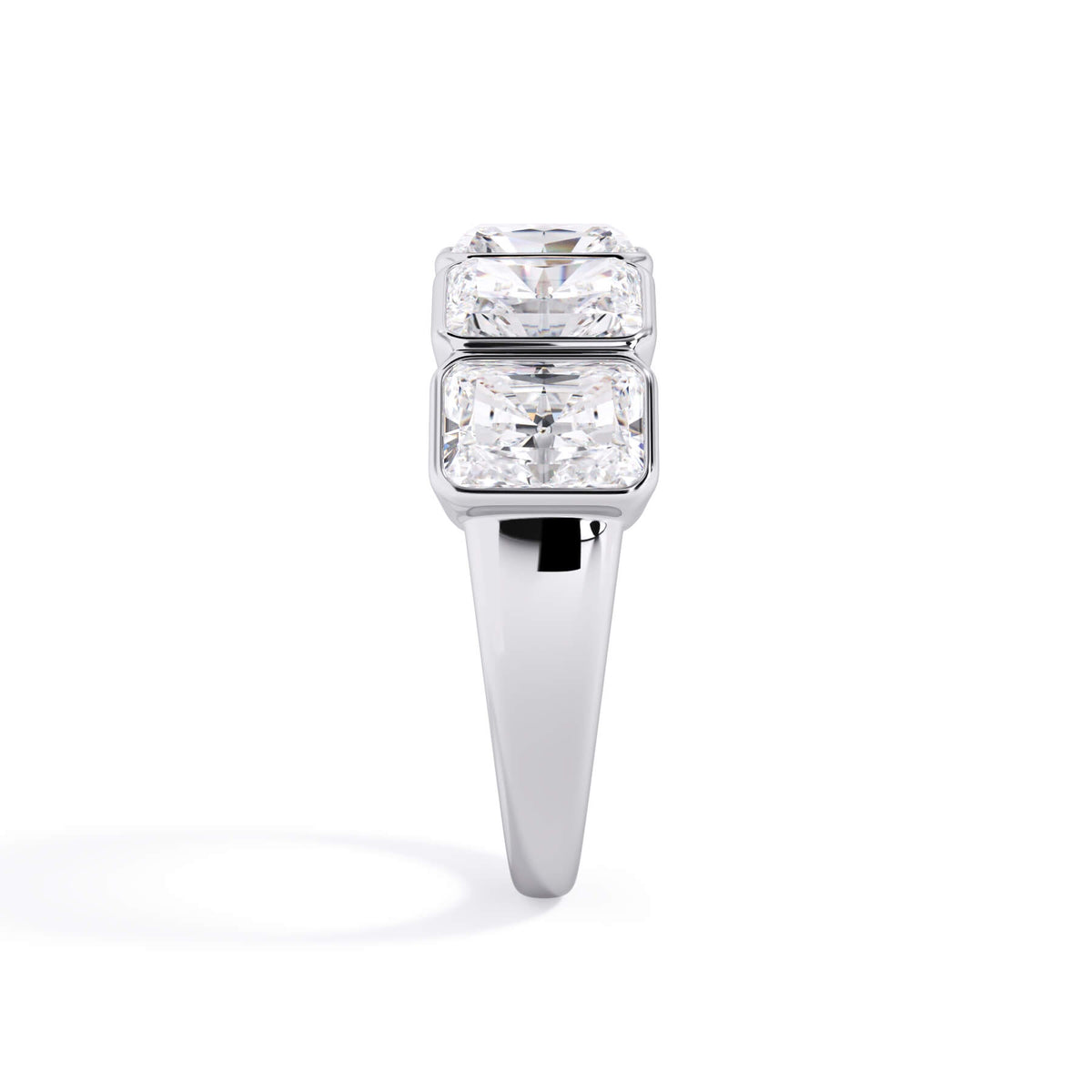A picture of a five stone diamond wedding ring with radiant cut diamonds that are bezel set in white gold or platinum on a white background with a side profile view.