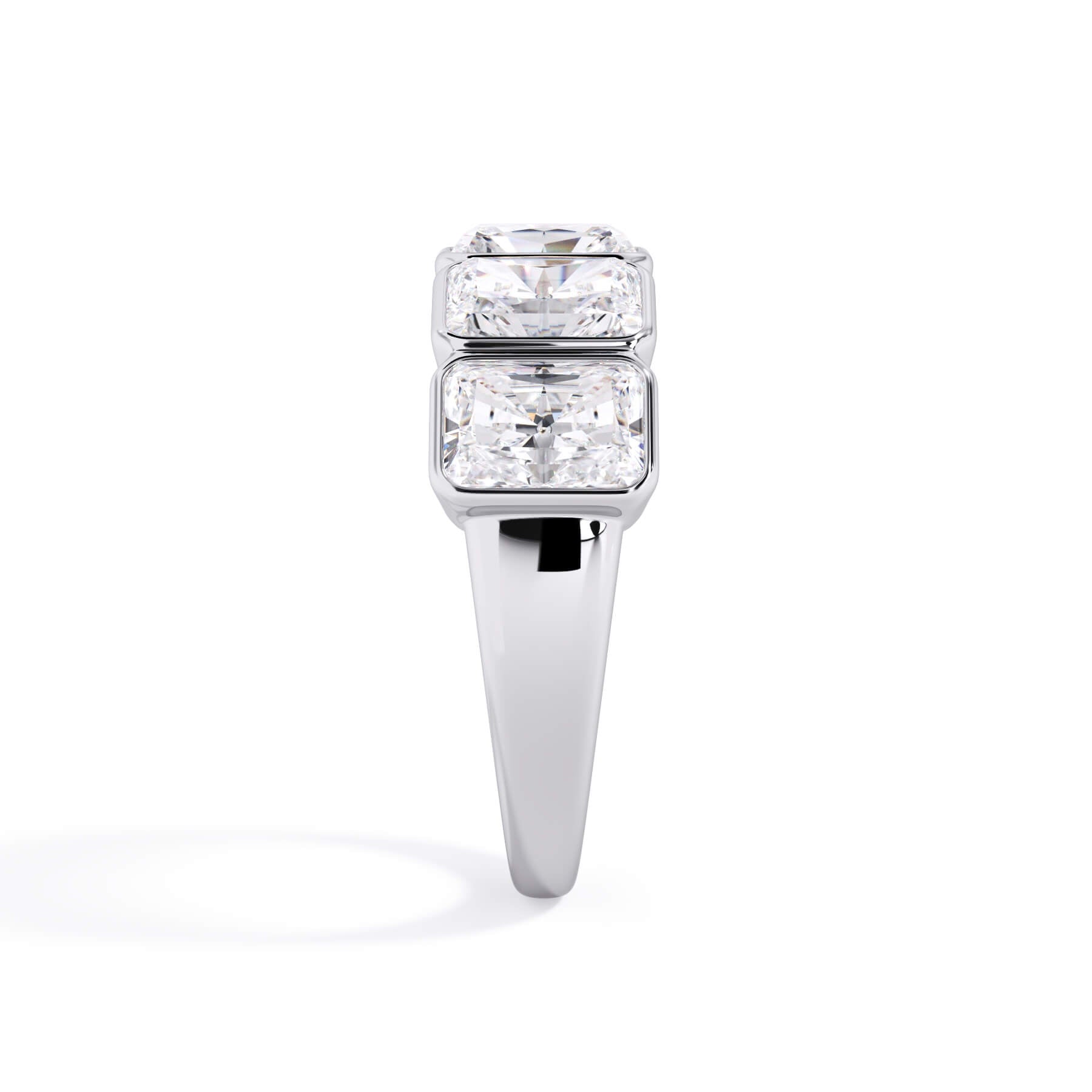 A picture of a five stone diamond wedding ring with radiant cut diamonds that are bezel set in white gold or platinum on a white background with a side profile view.