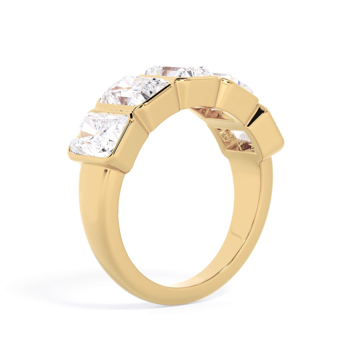 A picture of a five stone diamond wedding ring with radiant cut diamonds that are bezel set in yellow gold on a white background with a slightly angled, through the finger view.