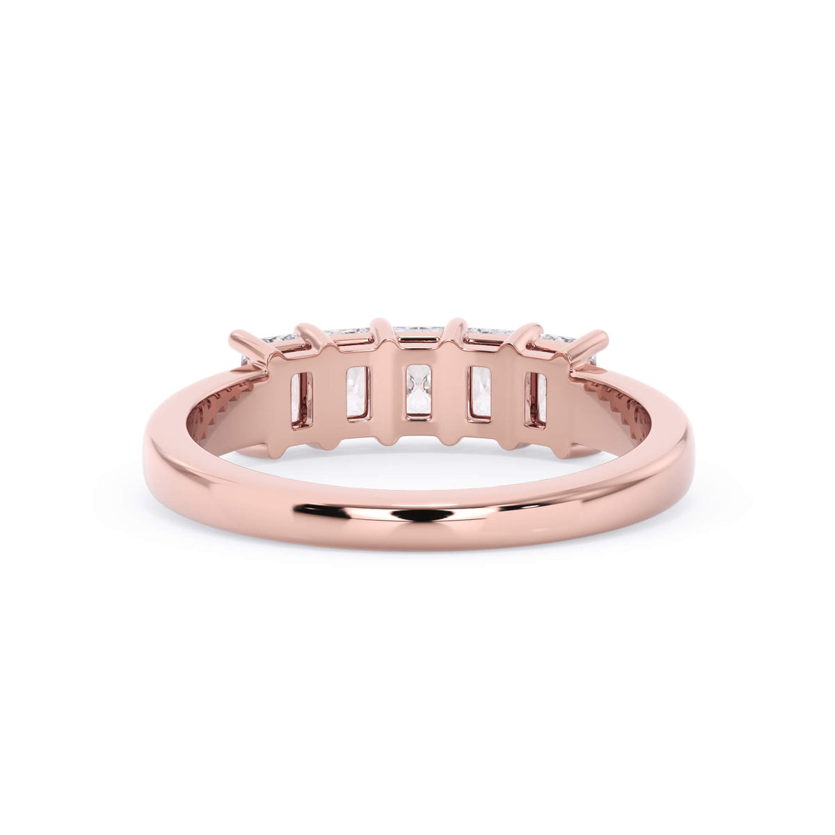 A picture of a five stone diamond wedding ring with radiant cut diamonds that are shared prong set in rose gold on a white background with a view of the underside of the ring.