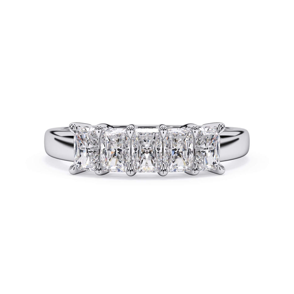 A picture of a five stone diamond wedding ring with radiant cut diamonds that are shared prong set in white gold or platinum on a white background with the ring facing forward, lying down.