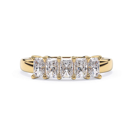 A picture of a five stone diamond wedding ring with radiant cut diamonds that are shared prong set in yellow gold on a white background with the ring facing forward, lying down.