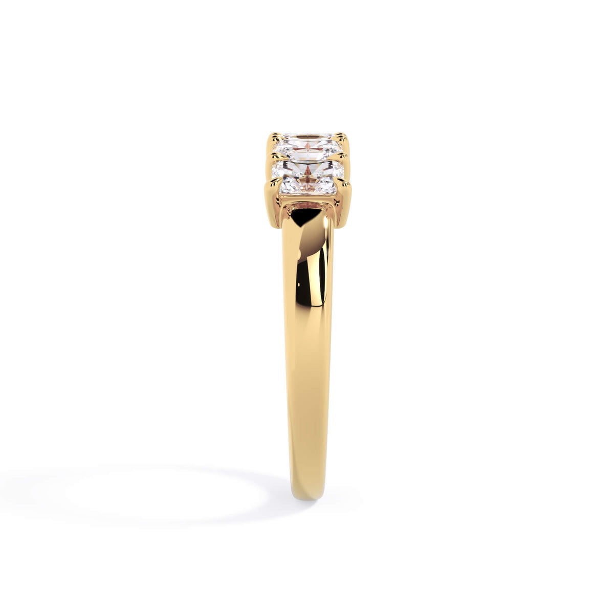 A picture of a five stone diamond wedding ring with radiant cut diamonds that are shared prong set in yellow gold on a white background with a side profile view.
