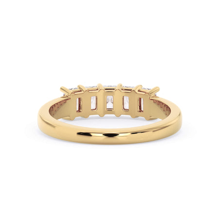 A picture of a five stone diamond wedding ring with radiant cut diamonds that are shared prong set in yellow gold on a white background with a view of the underside of the ring.
