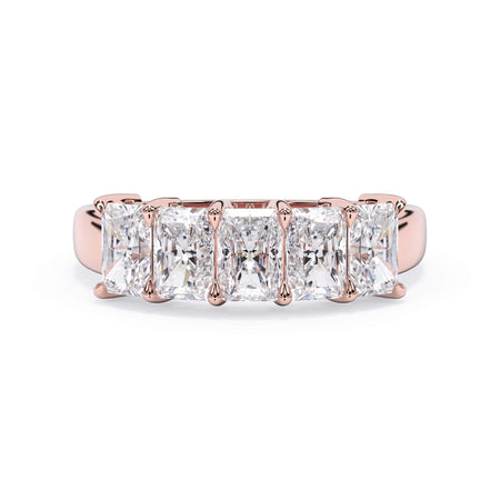 A picture of a five stone diamond wedding ring with radiant cut diamonds that are shared prong set in rose gold on a white background with the ring facing forward, lying down.