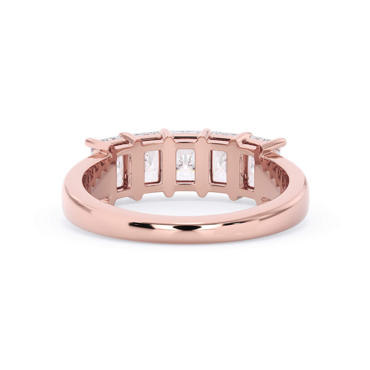 A picture of a five stone diamond wedding ring with radiant cut diamonds that are shared prong set in rose gold on a white background with a view of the underside of the ring.