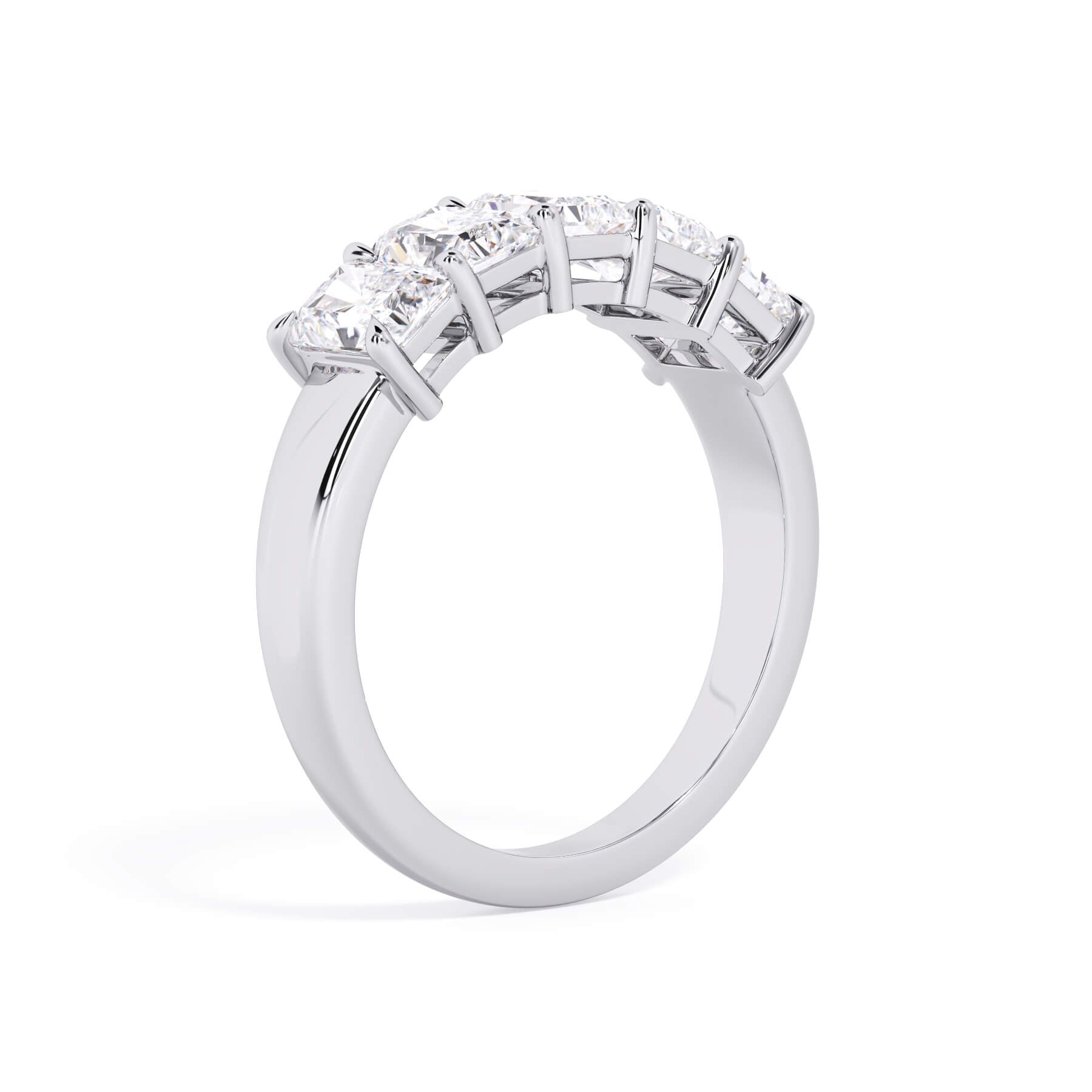 A picture of a five stone diamond wedding ring with radiant cut diamonds that are shared prong set in white gold or platinum on a white background with a slightly angled, through the finger view.