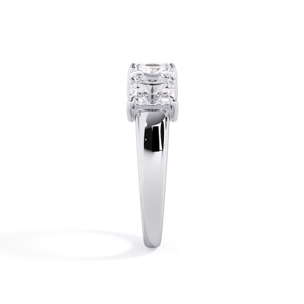 A picture of a five stone diamond wedding ring with radiant cut diamonds that are shared prong set in white gold or platinum on a white background with a side profile view.