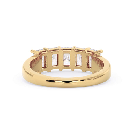 A picture of a five stone diamond wedding ring with radiant cut diamonds that are shared prong set in yellow gold on a white background with a view of the underside of the ring.