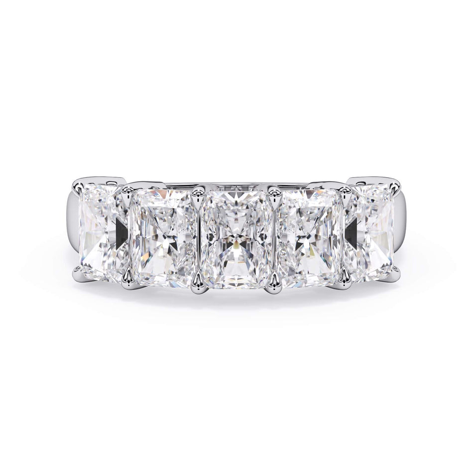 A picture of a five stone diamond wedding ring with radiant cut diamonds that are shared prong set in white gold or platinum on a white background with the ring facing forward, lying down.