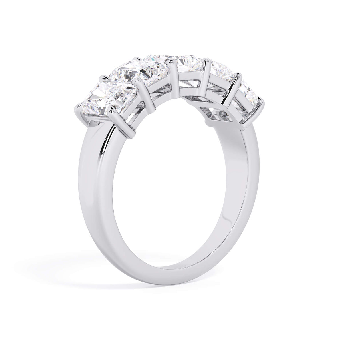 A picture of a five stone diamond wedding ring with radiant cut diamonds that are shared prong set in white gold or platinum on a white background with a slightly angled, through the finger view.