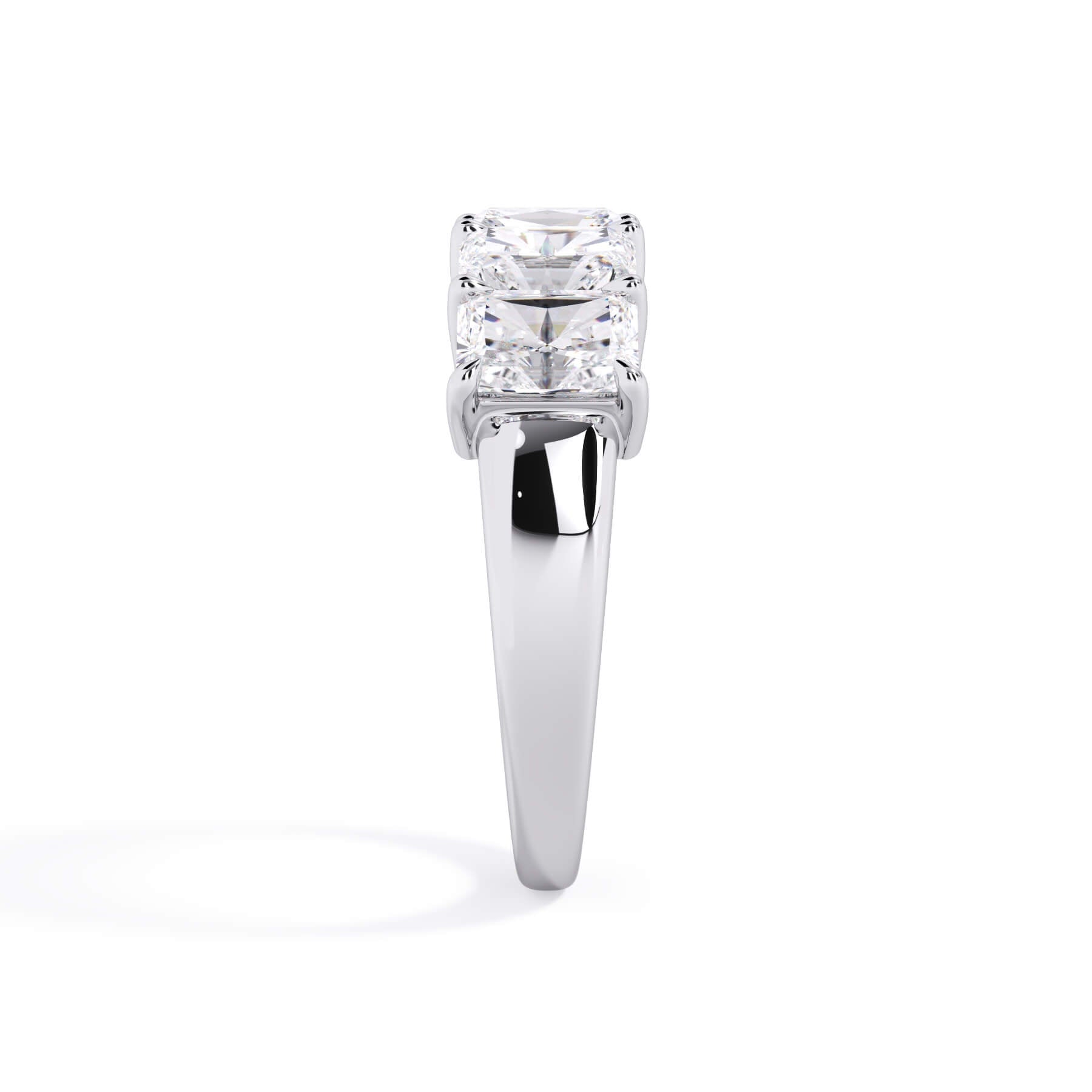 A picture of a five stone diamond wedding ring with radiant cut diamonds that are shared prong set in white gold or platinum on a white background with a side profile view.