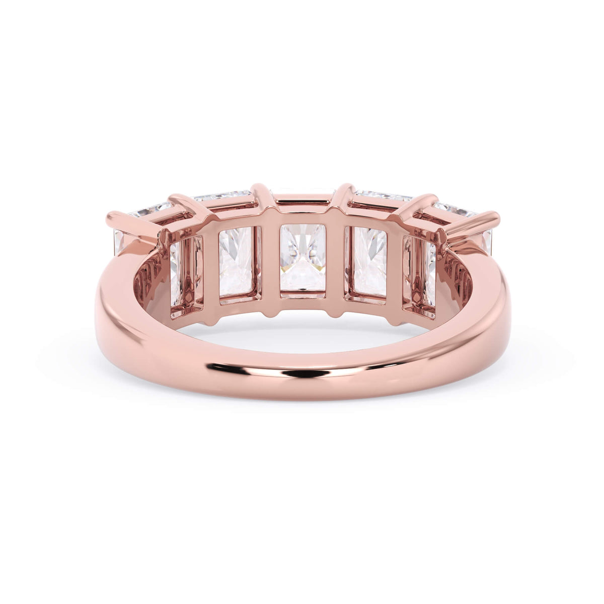 A picture of a five stone diamond wedding ring with radiant cut diamonds that are shared prong set in rose gold on a white background with a view of the underside of the ring.