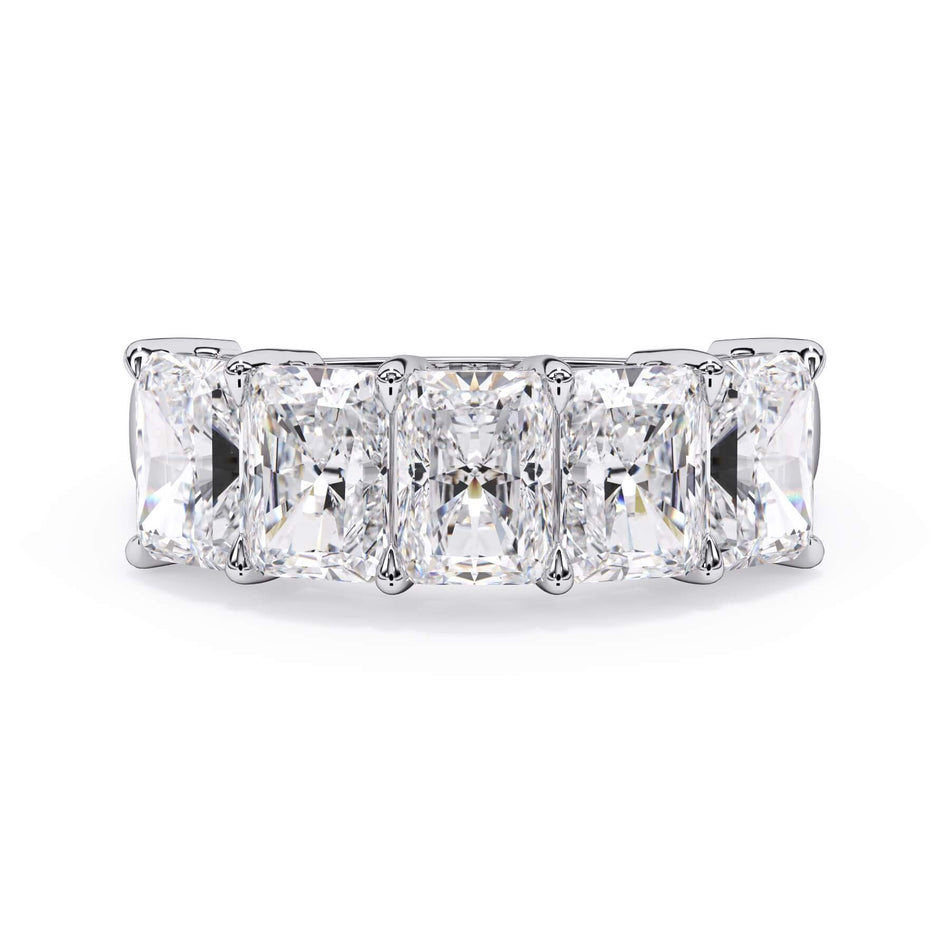 A picture of a five stone diamond wedding ring with radiant cut diamonds that are shared prong set in white gold or platinum on a white background with the ring facing forward, lying down.