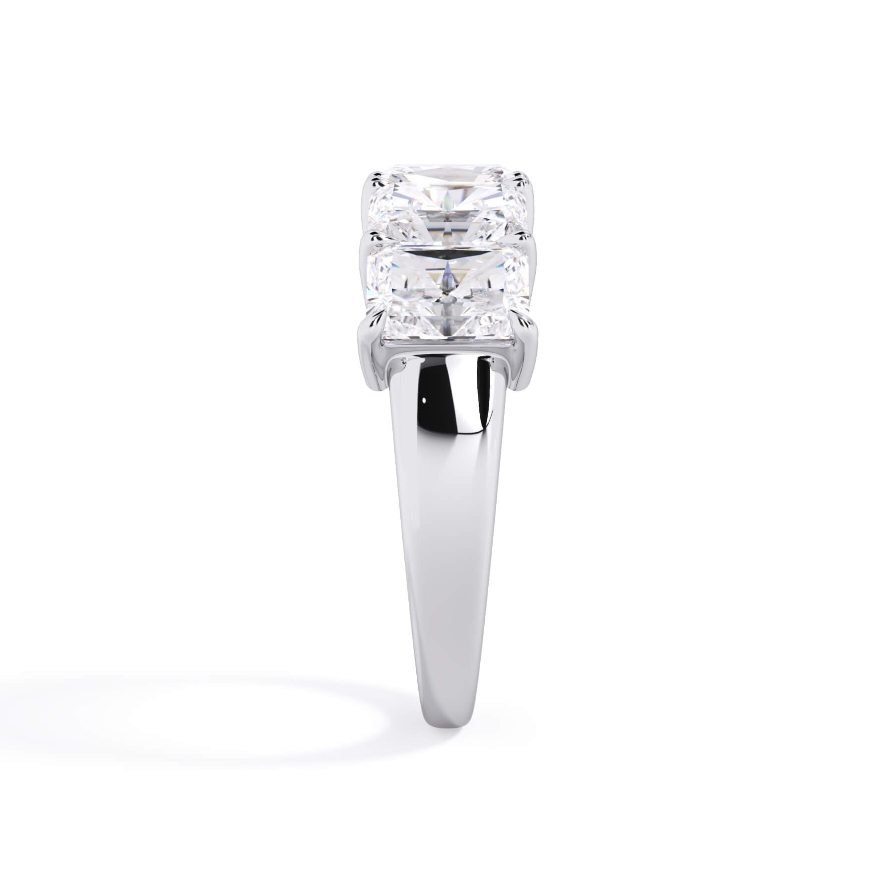 A picture of a five stone diamond wedding ring with radiant cut diamonds that are shared prong set in white gold or platinum on a white background with a side profile view.