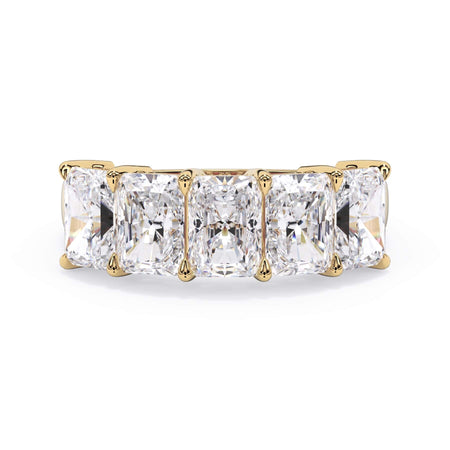 A picture of a five stone diamond wedding ring with radiant cut diamonds that are shared prong set in yellow gold on a white background with the ring facing forward, lying down.