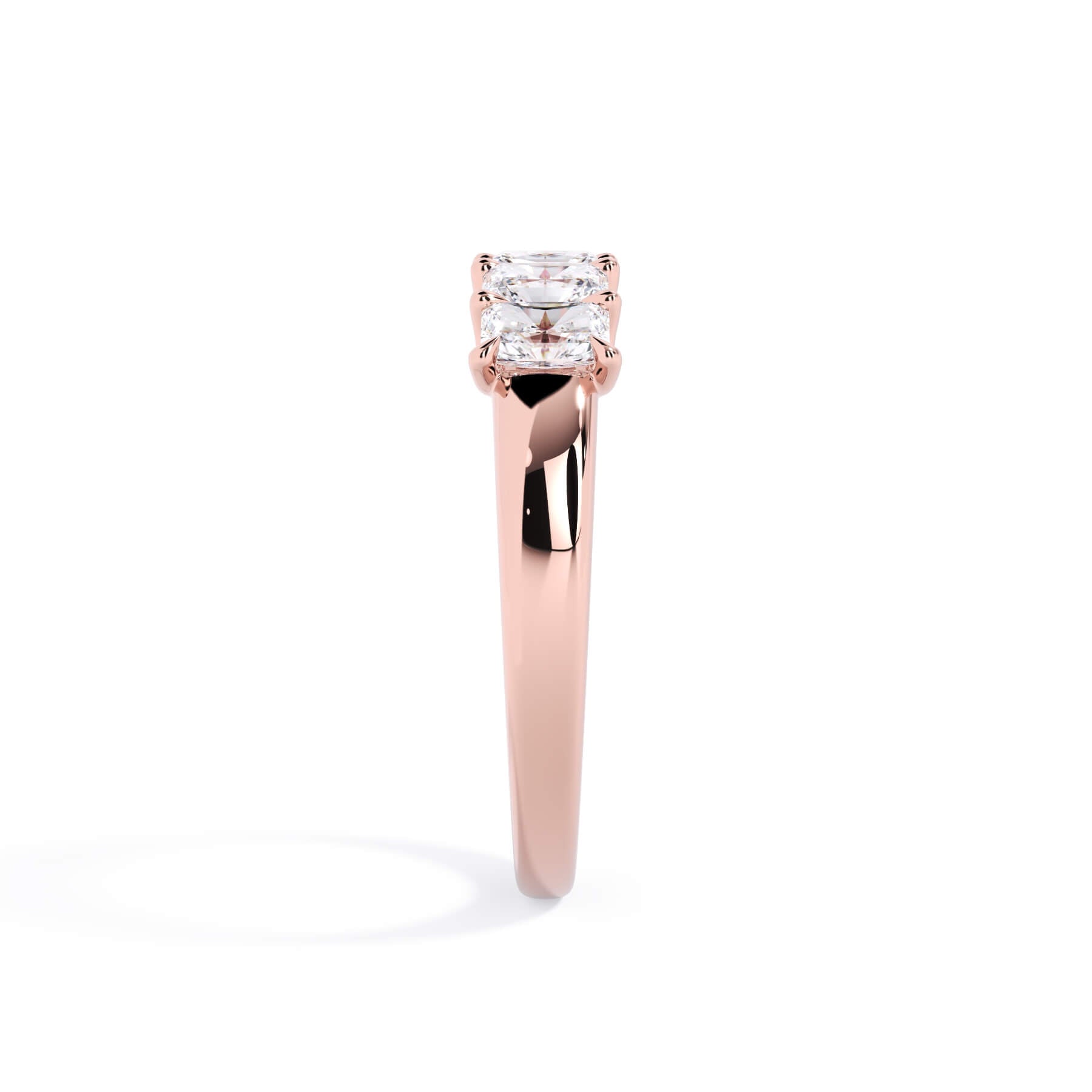 A picture of a five stone diamond wedding ring with radiant cut diamonds that are u prong set in rose gold on a white background with a side profile view.
