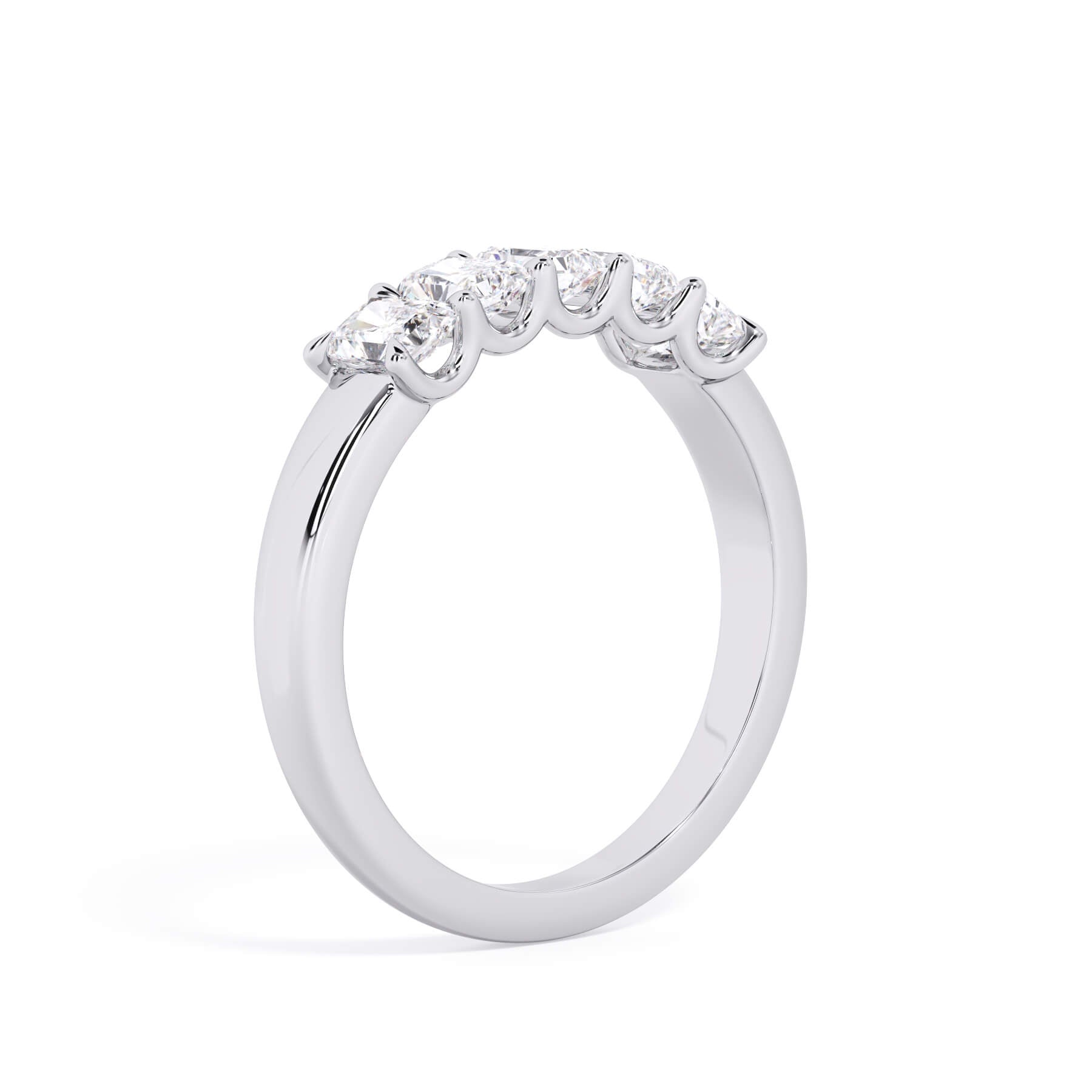 A picture of a five stone diamond wedding ring with radiant cut diamonds that are u prong set in white gold or platinum on a white background with a slightly angled, through the finger view.