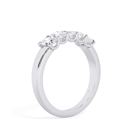 A picture of a five stone diamond wedding ring with radiant cut diamonds that are u prong set in white gold or platinum on a white background with a slightly angled, through the finger view.