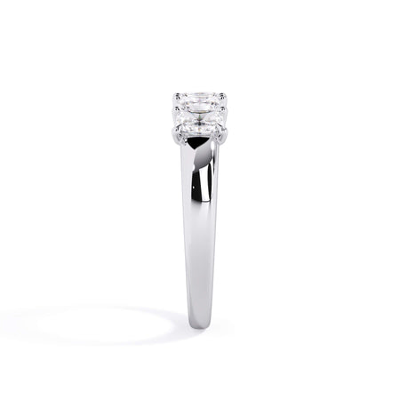 A picture of a five stone diamond wedding ring with radiant cut diamonds that are u prong set in white gold or platinum on a white background with a side profile view.